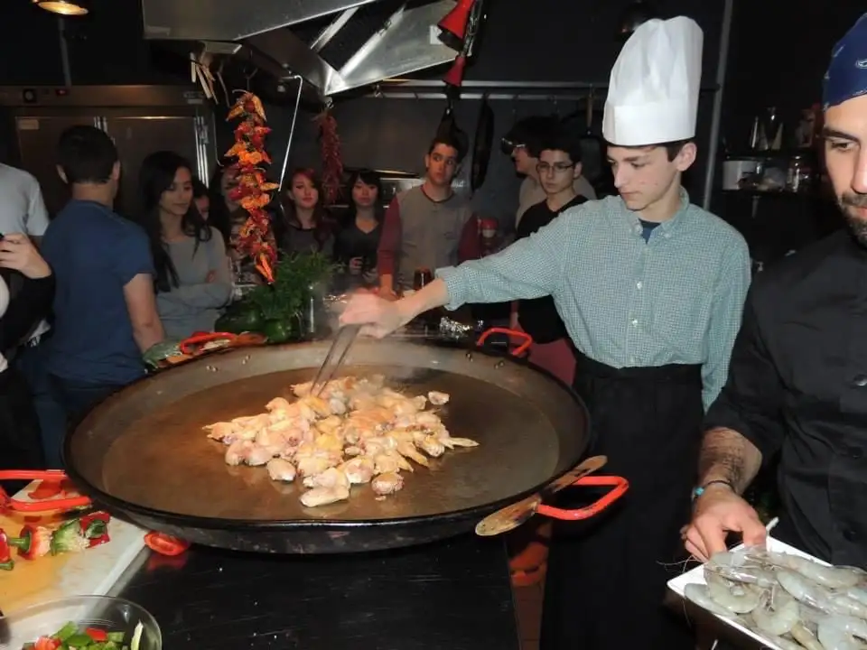 Cooking paella on a field trip to Spain at age 17.