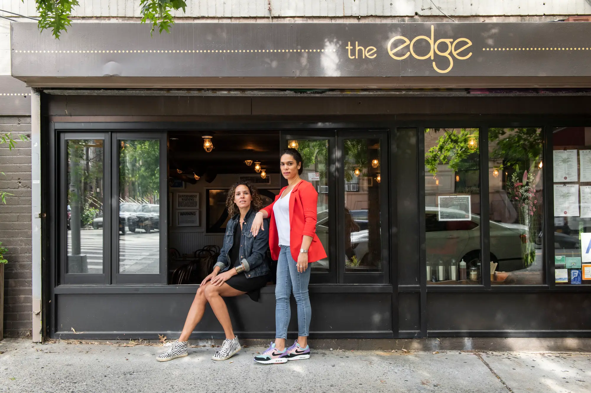 Women standing in front of a building