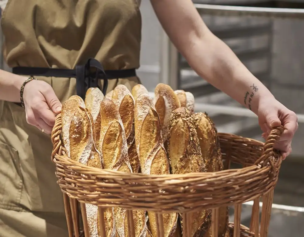 a person preparing food in a basket