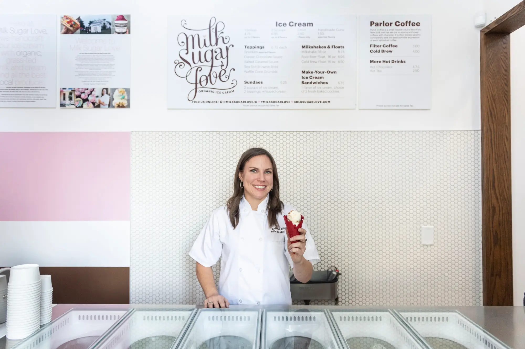 a woman standing with an ice cream cone.