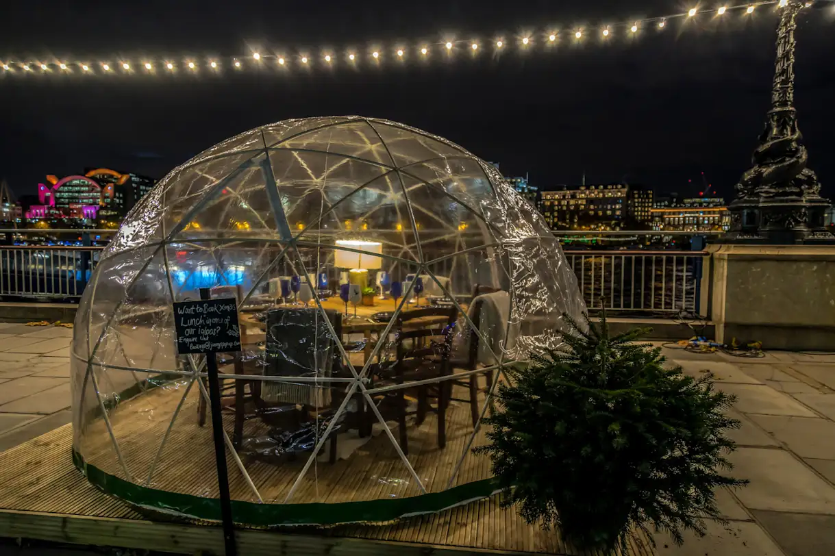 An example of restaurants using individual coverings over outdoor tables