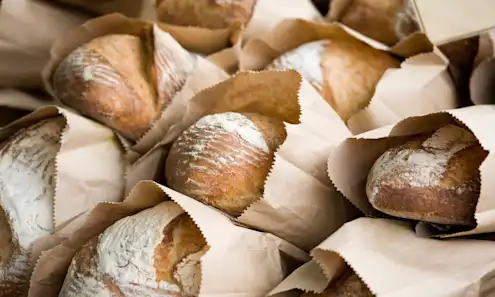 a close up of many different types of bread