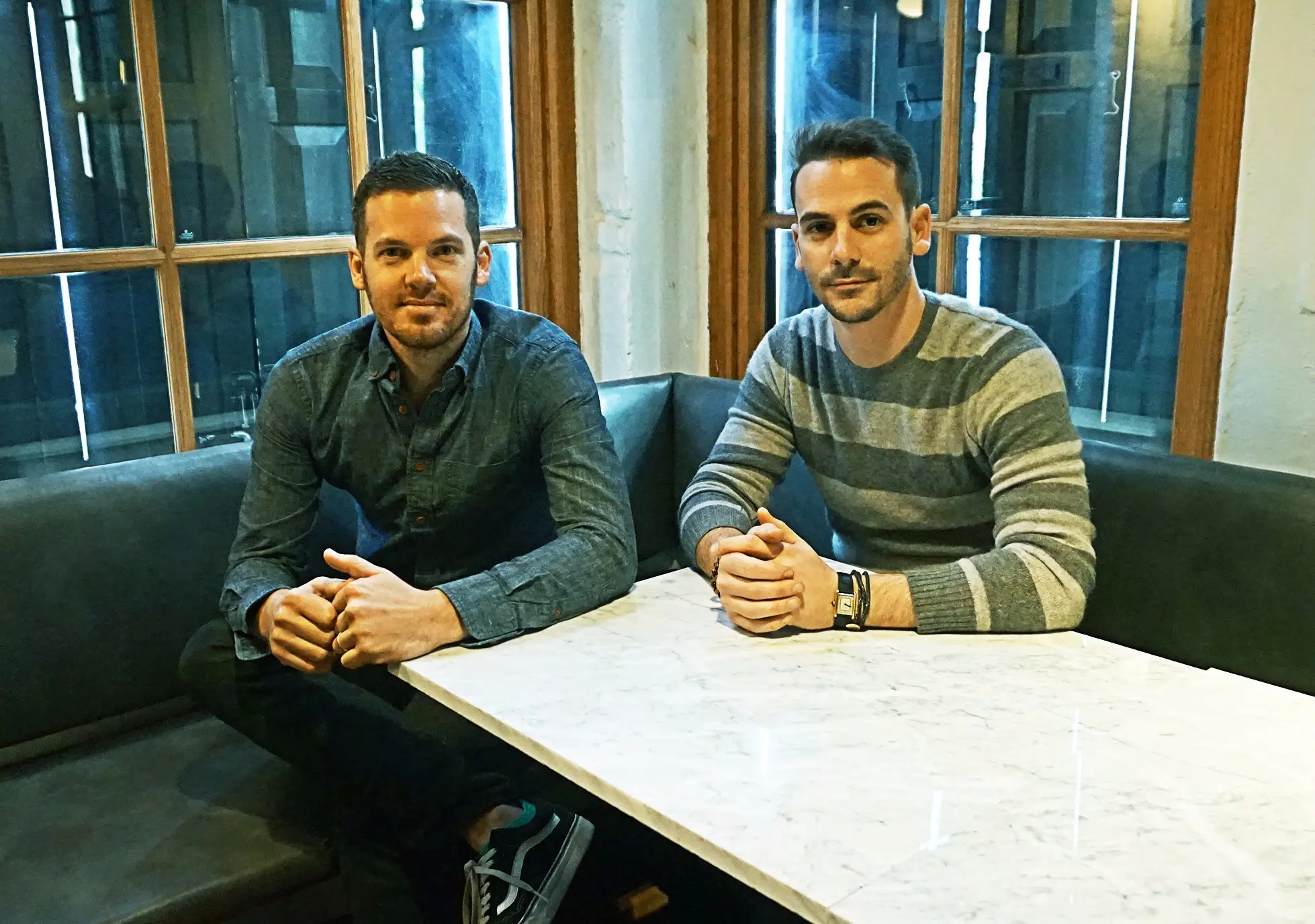 two men sitting at a table