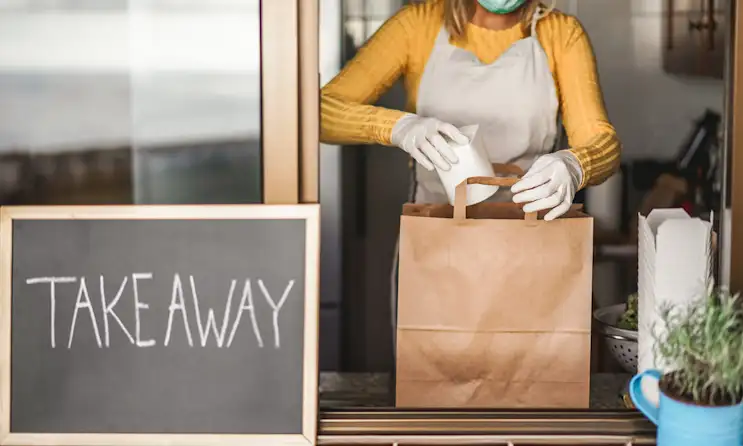 a woman sitting on a table