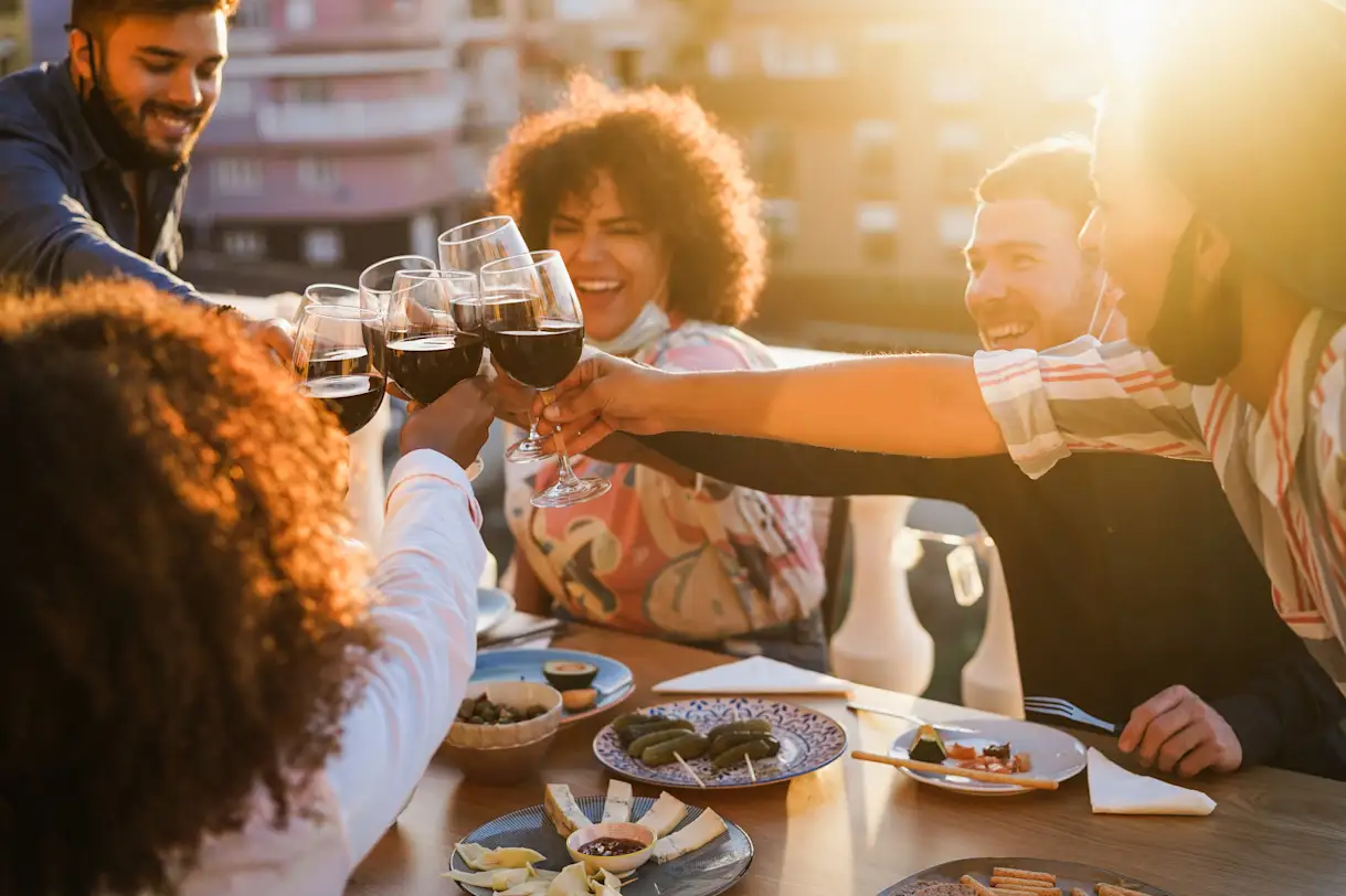 A group of friends drinking wine at a table