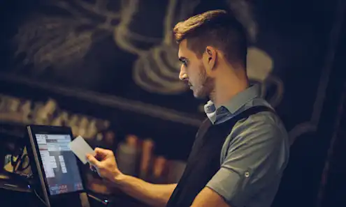 a man holding a laptop