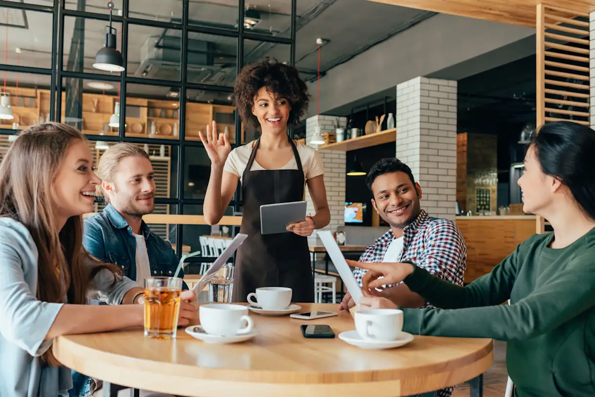 a group of people sitting at a table