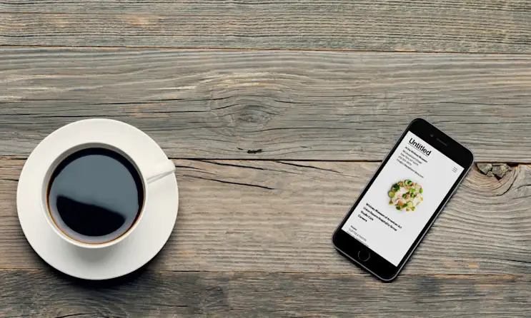 a stack of brochures on a wooden surface