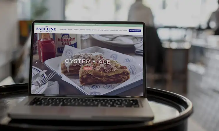 a laptop computer sitting on top of a table