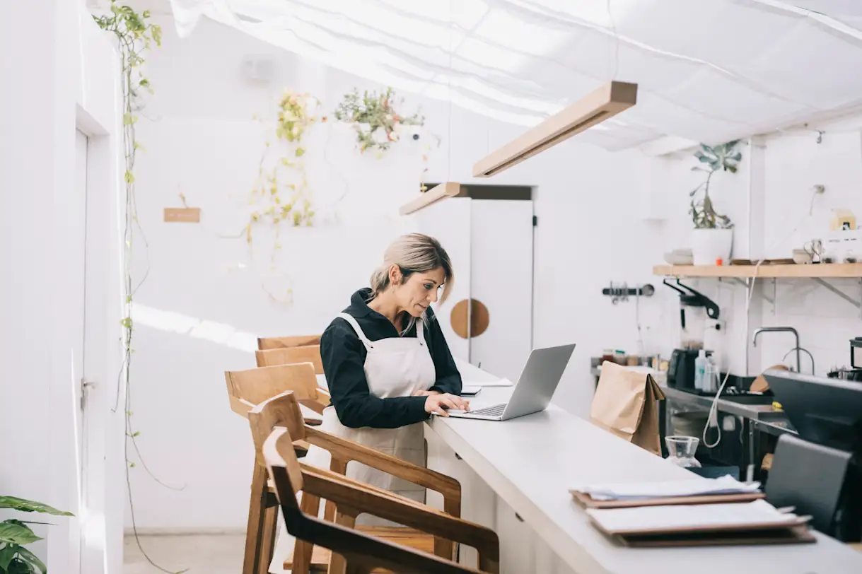 a woman sitting at a table in a room
