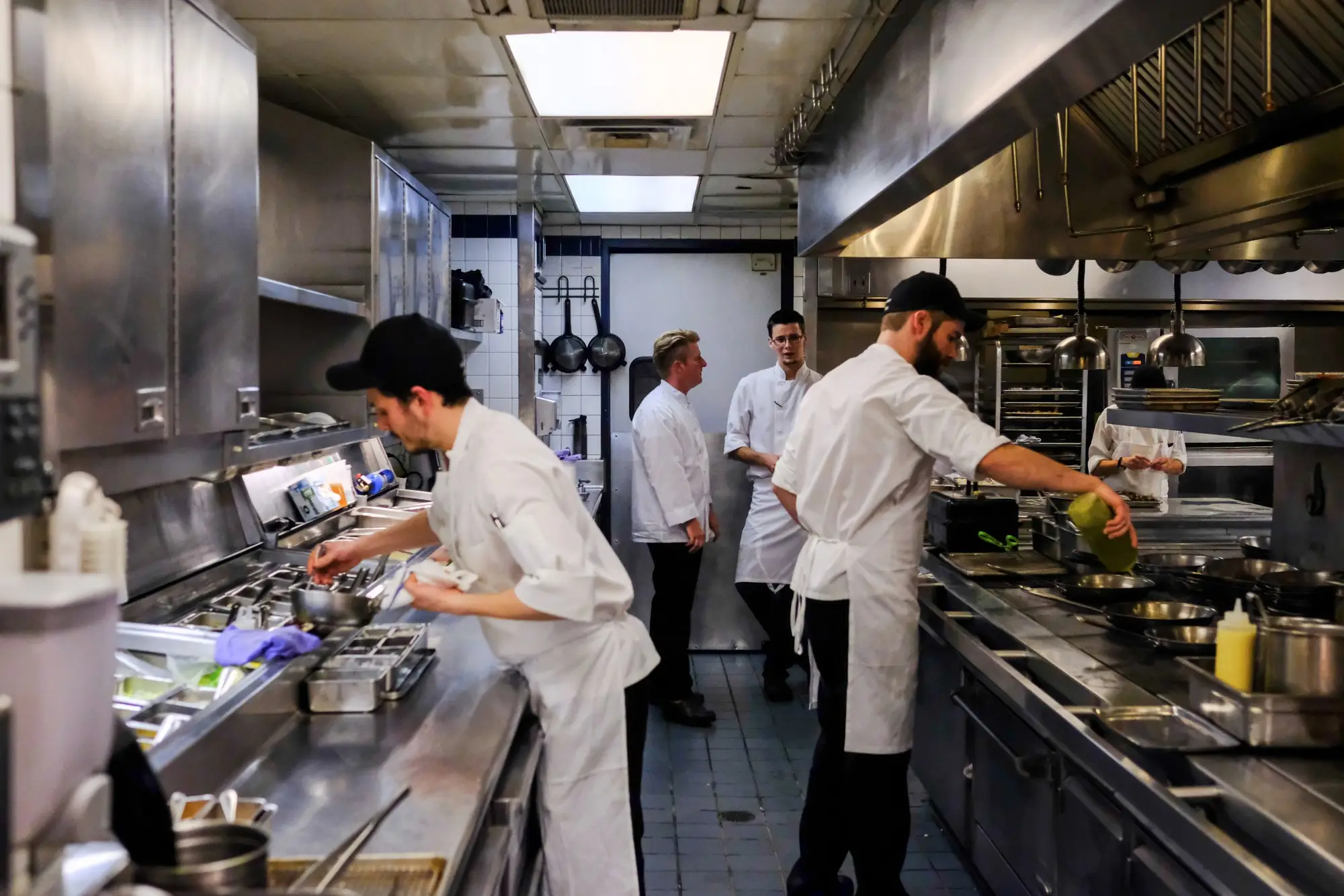 a person cooking in a kitchen preparing food