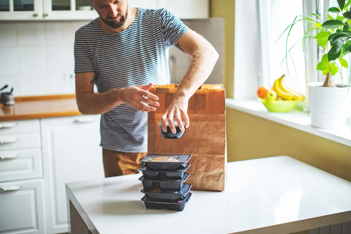 a person standing in a kitchen