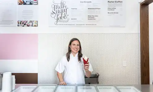 A woman holding an ice cream cone