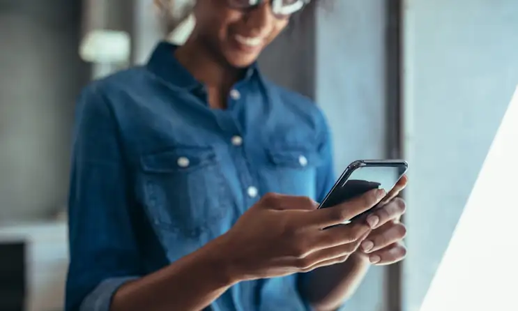 a person is using the cell phone