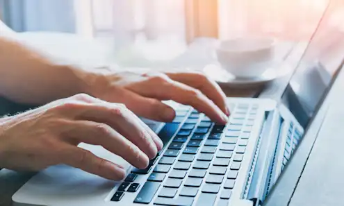 a person using a laptop computer