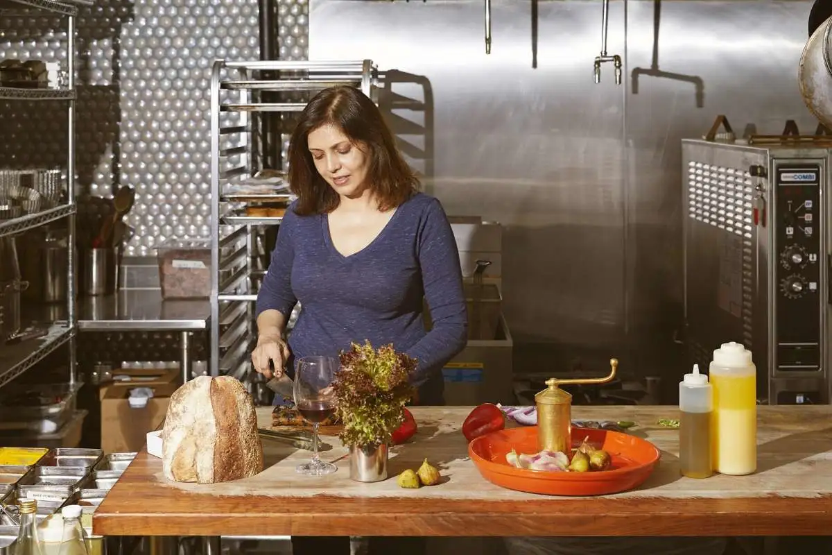 a woman standing at a table