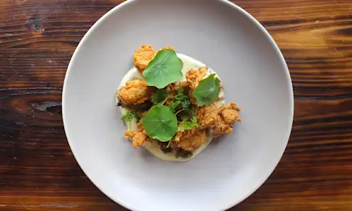 a plate of food on a wooden table