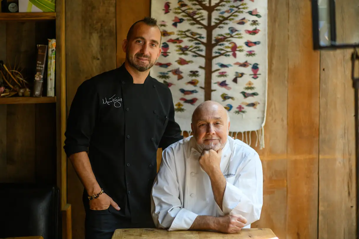 Father and son Marc Forgione and Larry Forgione pose together in a photo