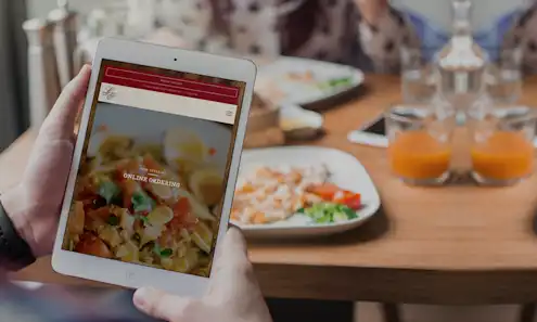 a pizza sitting on top of a wooden table