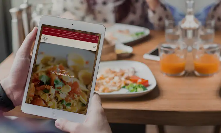 a pizza sitting on top of a wooden table