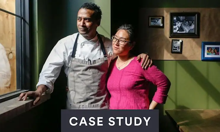 a man and a woman standing in a room