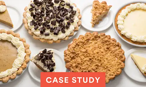 a plate of food with a slice of cake on a table