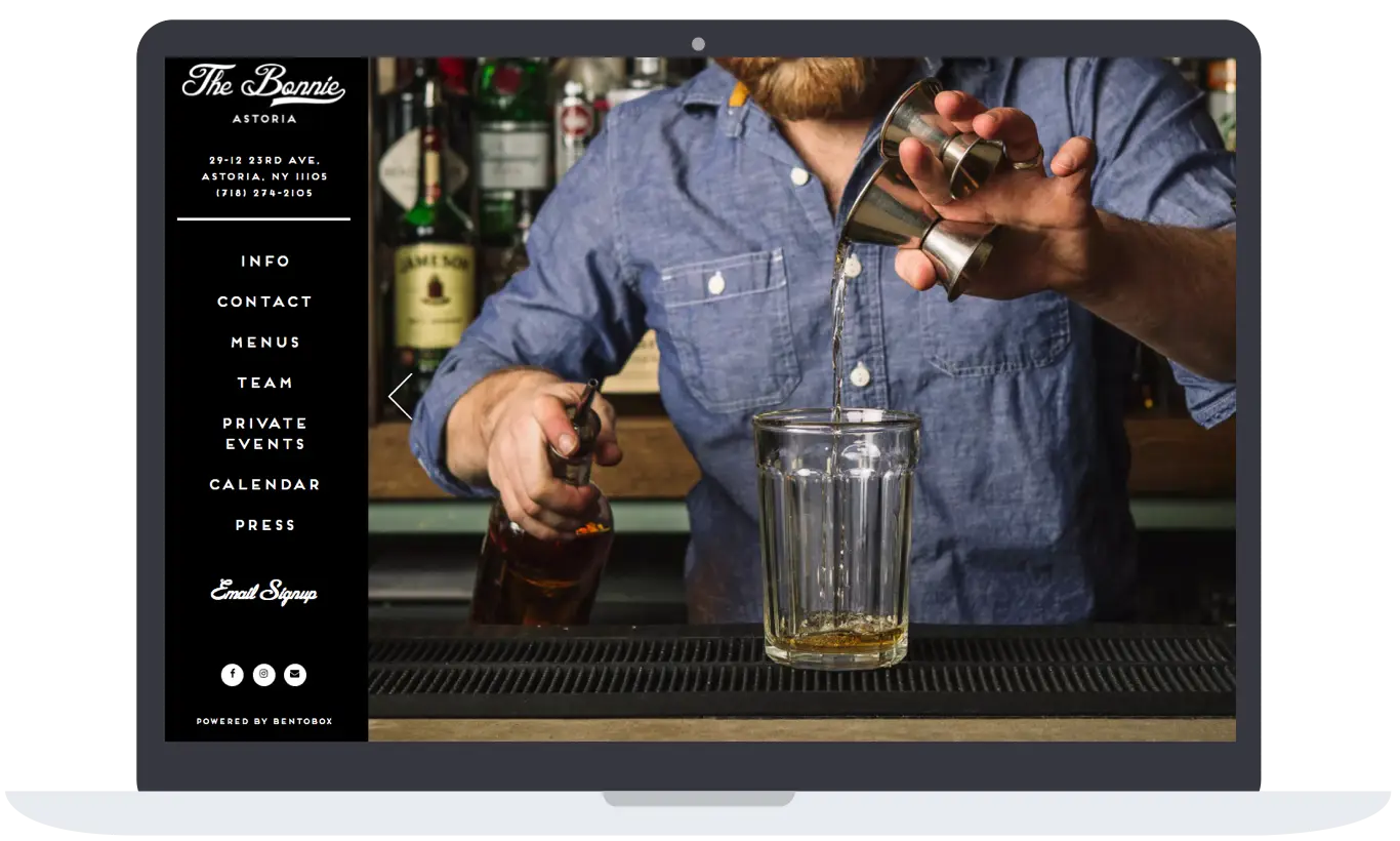A bartender making a drinking at a bar.