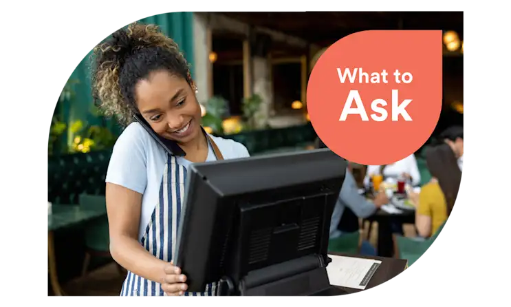 woman takes restaurant reservations while on the phone